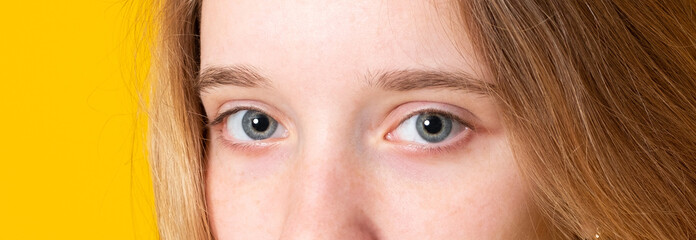 Close-up portrait of a beautiful female blue eye