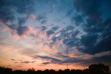 Fototapeta premium beautiful bright sunset, expressive blue-orange sky. Evening time