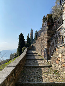View of the lake and mountains, Morcote, Switzerland. sunny day. Old town, gardens, mountain walking