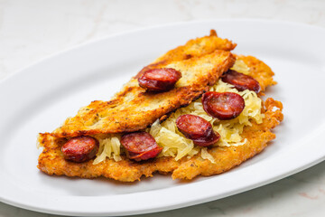 potato pancake filled with cabbage and sausage