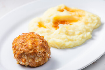meat ball with cheese served with mashed potatoes