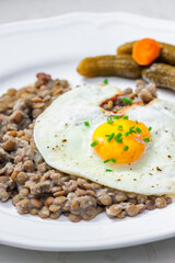 lentils with fried egg and pickled vegetables