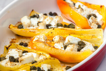 baked yellow peppers with feta cheese and capers