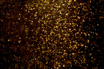 Gold bokeh of lights from water