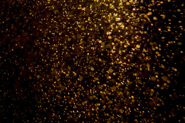 Gold bokeh of lights from water