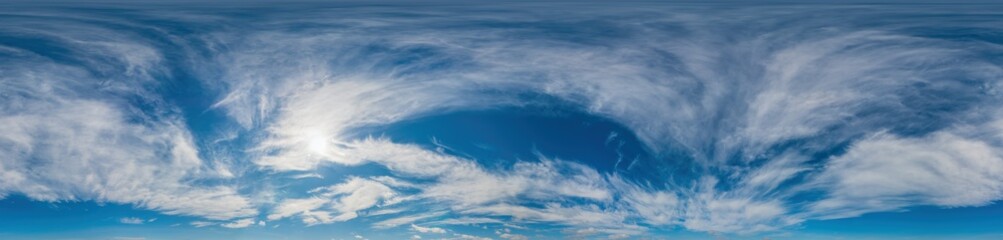 Blue sky panorama with Cirrus clouds in Seamless spherical equirectangular format. Full zenith for use in 3D graphics, game and editing aerial drone 360 degree panoramas for sky replacement. © panophotograph