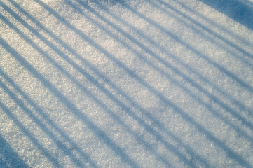 abstract background with blue parallel shadows in the snow