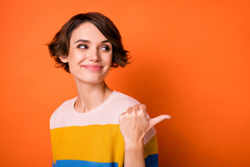 Portrait of charming positive girl look indicate finger empty space have good mood isolated on...