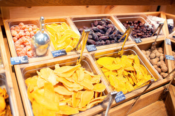 Many different dried exotic fruits are sold by weight in the store