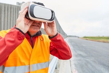 Construction workers with VR glasses on the construction site