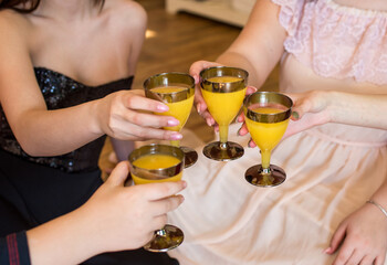 two women toasting with champagne