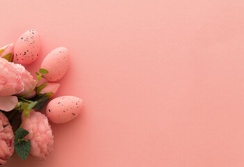 Fototapeta na wymiar Pink eggs with flowers peonies on pastel pink background. Happy Easter. Top view. Flat lay, copy space