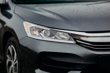 Concept of expensive, sports auto. Headlight lamp of new cars, copy space. Modern and elegant car illuminated. © Andrii  Kucheruk