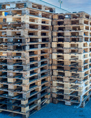 Piles of euro type cargo pallets used