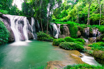 Motion bluured of blue water from Limestone mountains at Thanawan Waterfall,beautiful waterfalls in Doi Phu Nang National Park, Phayao, Thailand. Waterfall nature landscape.