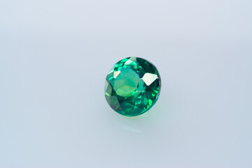 Natural gemstone green sapphire on white background