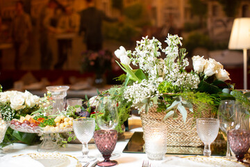 Tables served for special occasion, decorated with flower