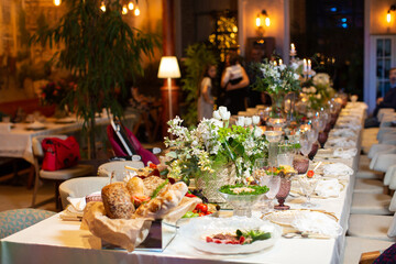 Tables served for special occasion, decorated with flower