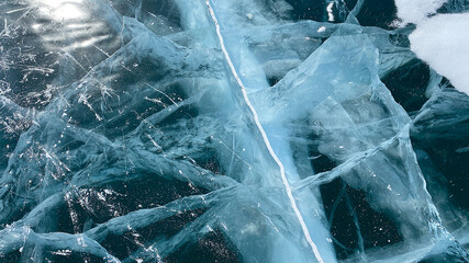Amazing unique pattern of frozen Lake Baikal. View from above. Blue transparent clear smooth ice