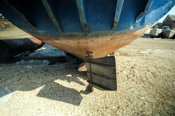 Old rusty abandoned ships are stranded near Cape Burkhan. Northern landscape of frozen Lake Baikal.