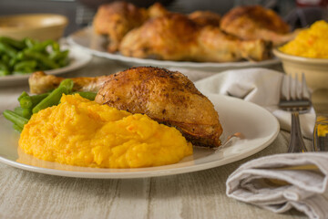 Chicken dinner with potato pumpkin puree and green beans