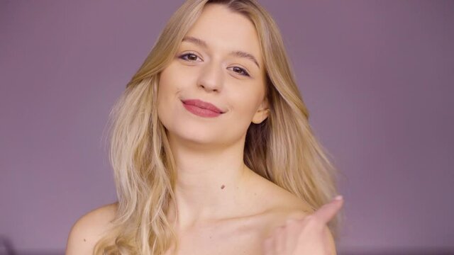 Content woman making faces at camera 