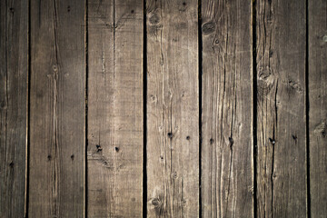 Dark textured brown wood background. Natural old wooden boards with nails. Copy space.