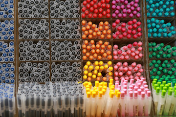 Colorful pens on display boxes in a stationery store