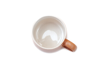 Brown mug for tea or coffee on a white background.