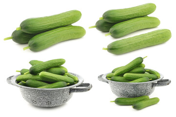 fresh green snack cucumbers and some in an enamel colander on a white background