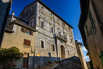 The small medieval village of Capranica Prenestina in Lazio, province of Rome. The imposing Palazzo Barberini, with the staircase and the large arched entrance. The brick and stone facade.