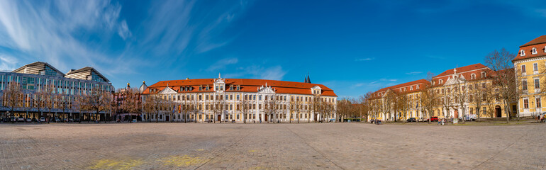 Panoramic view over major square with fountains in Magdeburg by Cathedral and Government Office, at sunny day and blue sky. - obrazy, fototapety, plakaty