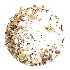 Circle of variuos flowers seeds isolated on white background. Pile dry flowers seeds, top view.