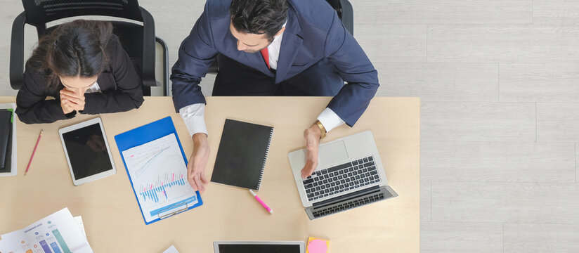 Business Board Discussion Banner Concept. Top View Two Diverse Corporate People In Suits Meeting Small Group With Other With Copy Space.