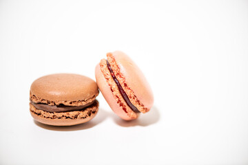 several multi-colored macaroon cakes on a white background