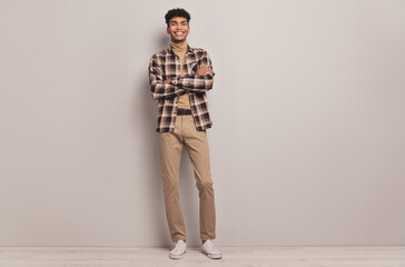 Full length photo of afro american happy man hold hands crossed good mood isolated on grey color background