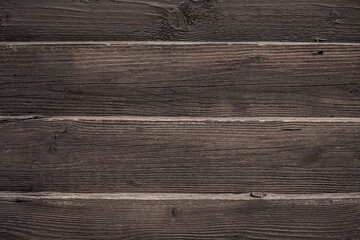 Wooden background, empty surface. old boards are dark brown. Wooden photophone in a rustic style