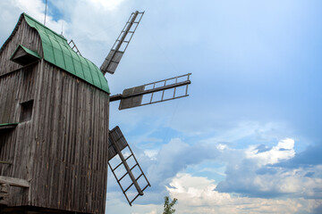 Summer landscape with an old wooden mill