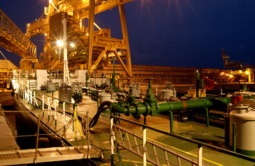 Small ship that loads fuel to refuel large ships at sea.