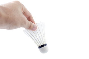 Hand holding shuttlecock used for badminton competition isolated on white background