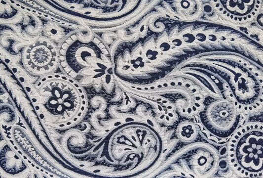 Navy blue and white paisley pattern. The seamless printed cotton design.