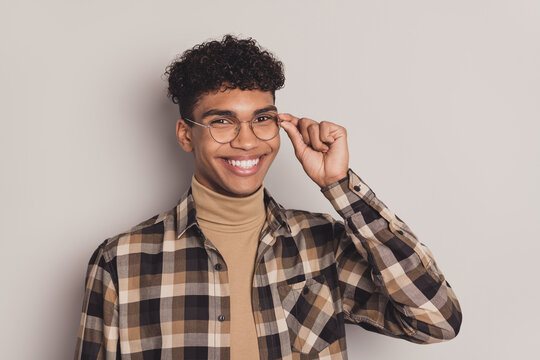 Photo of charming smart afro american young man wear glasses good mood isolated on grey color background