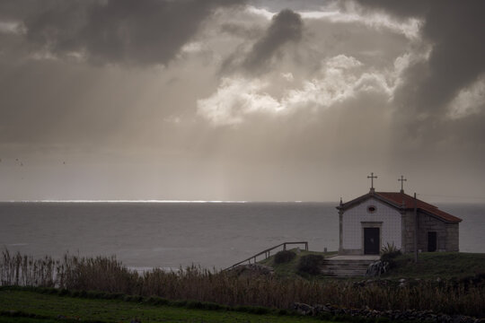 Chapel by the sea at sunset