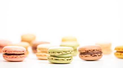 several multi-colored macaroon cakes on a white background