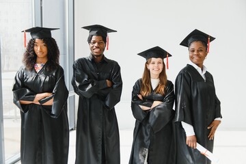optimistic young university graduates at graduation