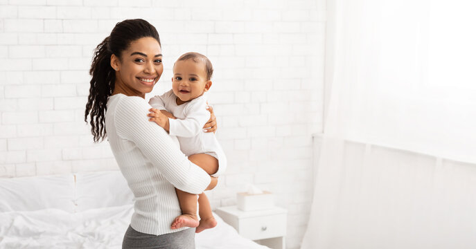 Young Black Mom Holding Baby Toddler Posing Standing Indoors, Panorama