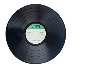 Closeup view of gramophone vinyl LP record or phonograph record with green label. Black musical...