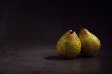 pears on a dark background