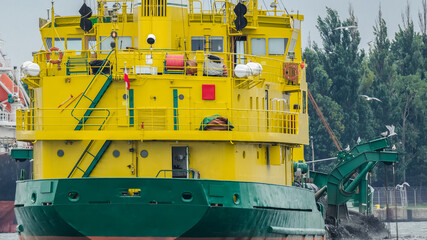 HOPPER DREDGER - A specialized vessel works on the fairway in the port
