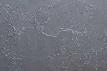 Gray background with textured paintable plaster. Decorative plastered venetian background. Cement texture.